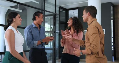 Diverse Team Celebrating Together at Workplace