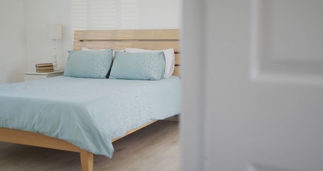 Minimalist Bedroom Interior with Elegant Blue Bedding - Download Free Stock Images Pikwizard.com