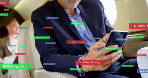 Businessman Engaging with Social Media While Traveling on Plane