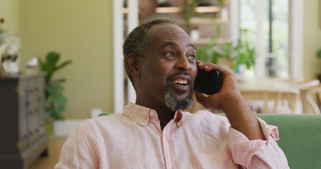 Happy Man Talking on Phone in Relaxed Home Environment - Download Free Stock Images Pikwizard.com