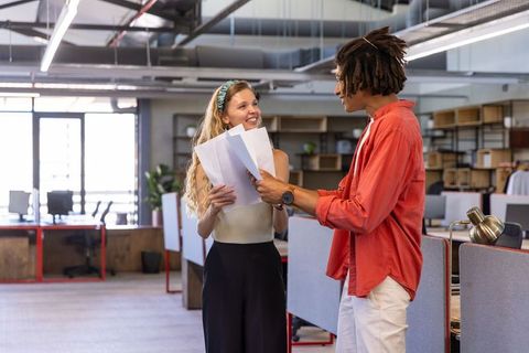 Diverse professionals sharing ideas in modern office