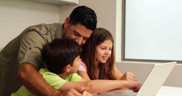 Father Helping Children with Online Learning on Laptop - Download Free Stock Images Pikwizard.com