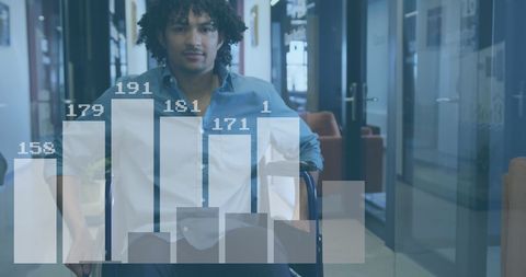 Confident businessman in wheelchair analyzing data