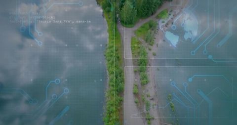 Aerial isthmus with circuit grid overlay along lake shoreline, forest path and digital globe