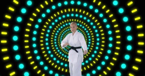 Karate Expert Performs Under Neon Circular Lights