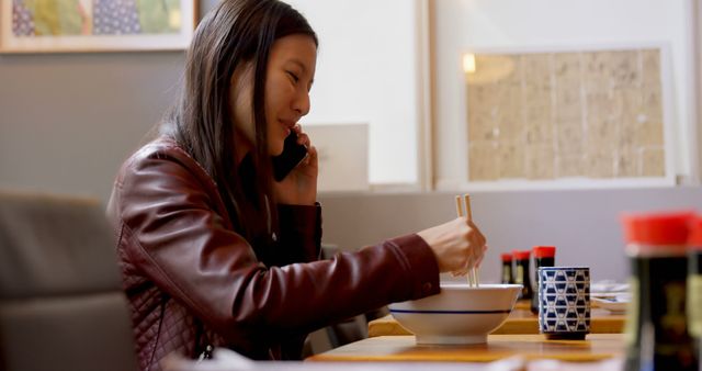 Woman Dining Alone Using Phone in Japanese Restaurant - Download Free Stock Images Pikwizard.com