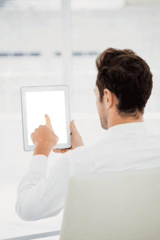 Businessman Pointing at Transparent Tablet in Office Environment - Download Free Stock Videos Pikwizard.com