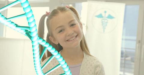 Smiling girl standing in pediatric clinic with glowing DNA helix and caduceus emblem