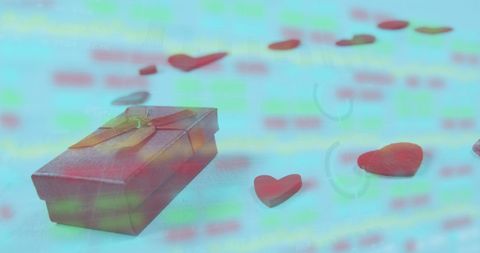 Gift Box and Hearts with Stock Market Overlay Showing Market Trends