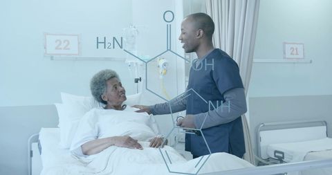 a male doctor in scrubs interacting with a senior female patient in a hospital bed, with a transparent element diagram overlay, representing modern technology in healthcare. useful for illustrating themes of innovation, medical care, doctor-patient relationships, and the use of technology in hospitals.