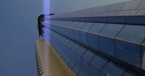 Innovative skyscraper with reflective glass and led accent