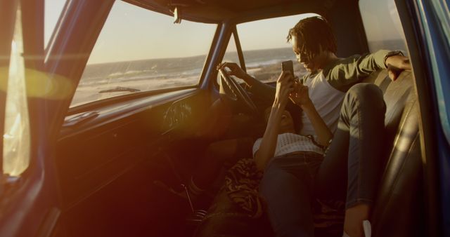 Couple Relaxing Inside Car at Sunset by the Beach - Download Free Stock Images Pikwizard.com