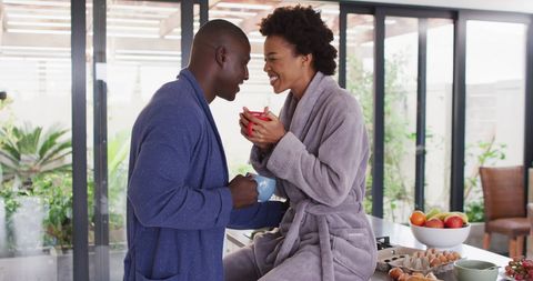 Couple in Kitchen Enjoying Morning Coffee Together