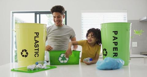 Father and Son Recycling Together at Home Eco-Friendly Living