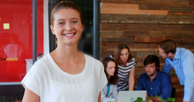 Confident Businesswoman with Team in Office - Download Free Stock Images Pikwizard.com