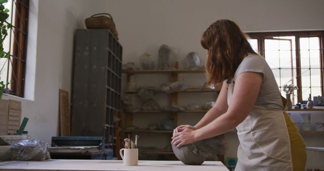 Female Artisan Kneading Clay in Workshop - Download Free Stock Images Pikwizard.com