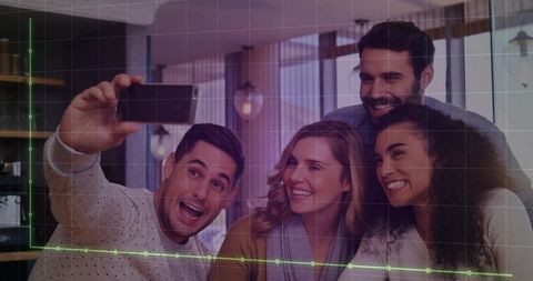 Smiling Friends Posing for Selfie in Modern Workspace