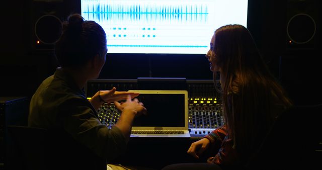 Two Women Collaborating in Music Recording Studio Working on Sound Mixing - Download Free Stock Images Pikwizard.com