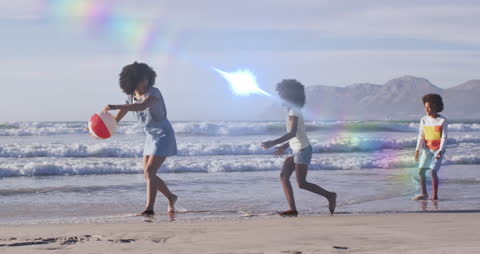 Family Enjoying Beach with Vibrant Light Trails