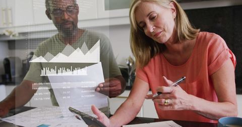 Diverse colleagues analyzing data visualization in office