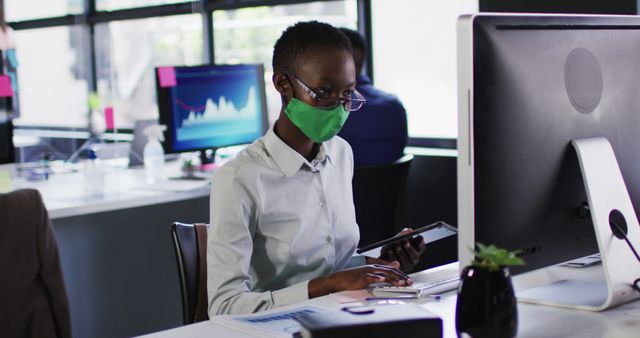 Office Worker Wearing Face Mask Working on Computer During COVID-19 - Download Free Stock Images Pikwizard.com