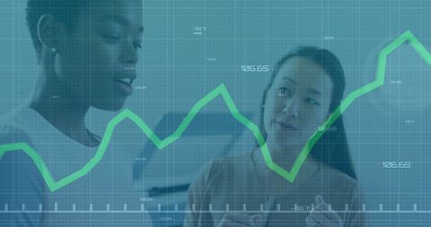 Diverse colleagues analyzing business graphs for growth strategy