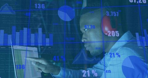 Focused Professional Analyzing Digital Financial Charts with Headphones