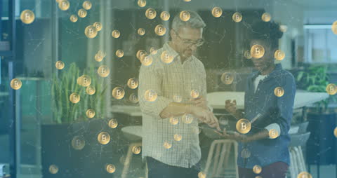 Business Colleagues Discussing Blockchain with Bitcoin Symbols Overlay