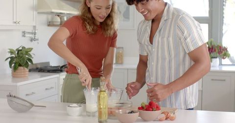 Couple Enjoying Home Cooking in Modern Kitchen Setting