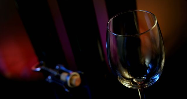 Close-up of Empty Wine Glass with Corkscrew in Background - Download Free Stock Images Pikwizard.com