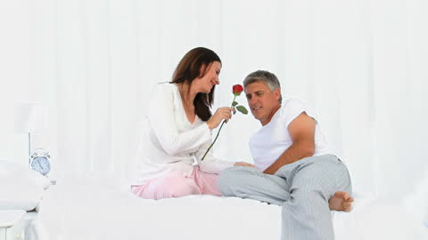 Romantic Couple Sharing Moment with Rose