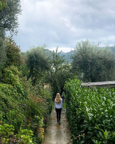 Tranquil Woman Walking on Mountain Garden Path