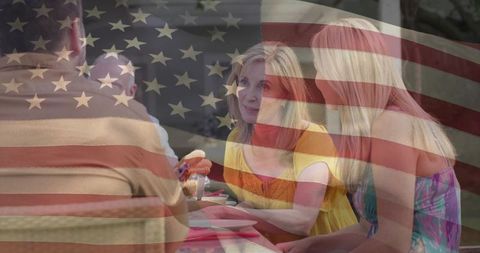 American Family Enjoying Outdoor Picnic Decoration with Flag Overlay