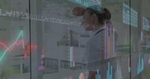 Doctor Analyzing Data on Interactive Transparent Display