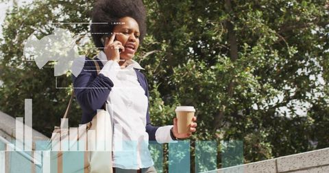 Businesswoman Balancing Work via Mobile Call with Coffee