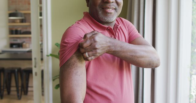 Smiling Senior Gentleman Showing Vaccine Bandage in Sunny Room - Download Free Stock Images Pikwizard.com