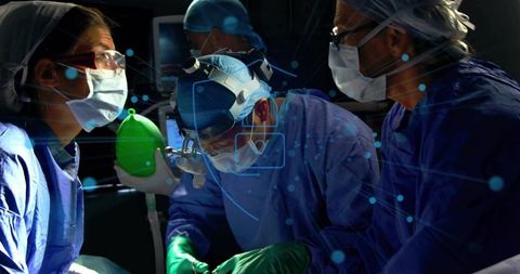 Surgical team performing complex operation wearing ppe using ambu bag with hud overlay