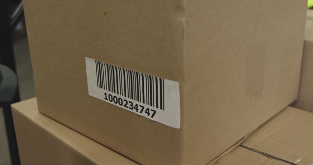 Stacked cardboard boxes with barcode labels for shipping or storage - Download Free Stock Images Pikwizard.com