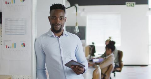 Professional Tech-savvy Businessman in Modern Office Environment