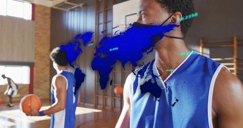 Youth basketball team practicing inside sunlit gym with face mask and global data overlay