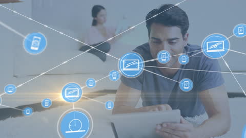 Couple Using Tablets with Digital Network Graphics Overlay