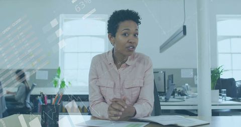 Businesswoman Engaging with Financial Data in Office Space
