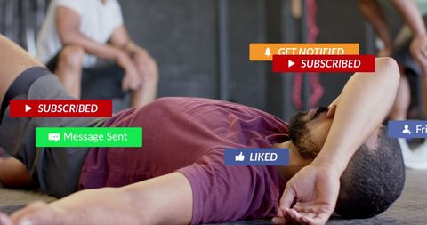 Exhausted Man Relaxing in Gym with Social Media Notifications