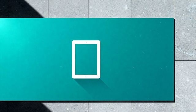 White tablet casting long diagonal shadow on teal minimalist geometric outdoor surface