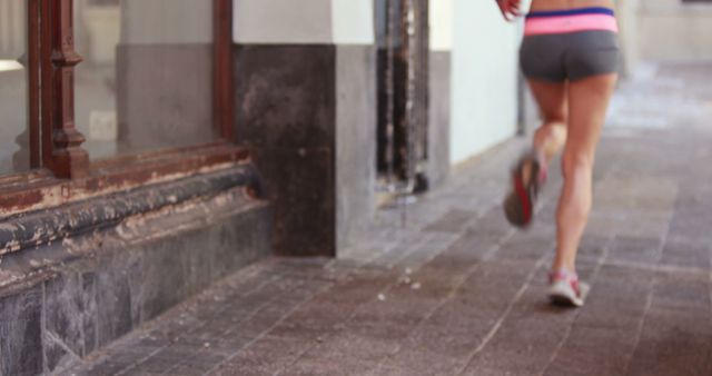 Fit Woman Running on Urban Sidewalk in Summer - Download Free Stock Images Pikwizard.com