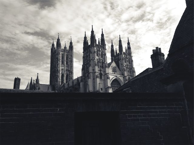 Majestic Gothic Cathedral Against Cloudy Sky - Download Free Stock Photos Pikwizard.com