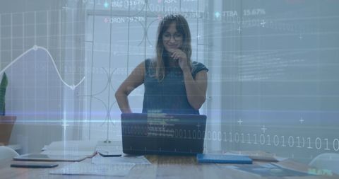 Businesswoman Analyzing Financial Data with Modern Technology