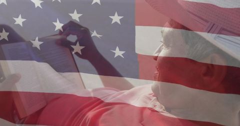 American Patriotism and Leisure, Senior Man Reading on Beach