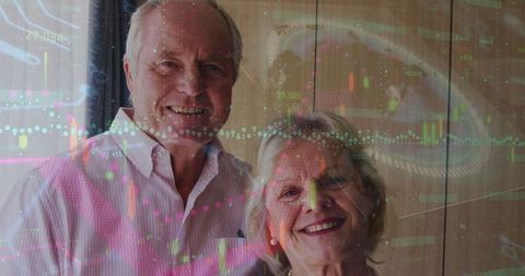 Smiling Senior Couple with Overlay of Financial Data Graphics