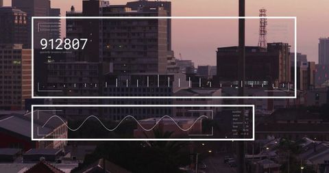 Futuristic data interface over urban sunset skyline